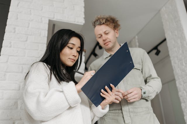 Woman signing rental form